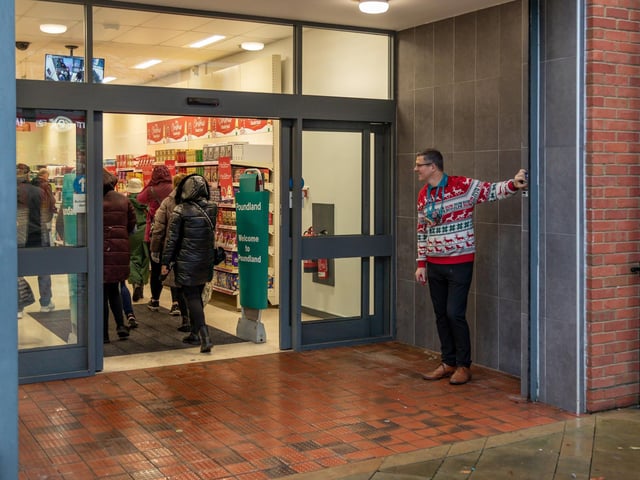 Tim Benham (Store Manager) opens the new Poundland store in West Street, Fareham. Picture: Mike Cooter (091223)