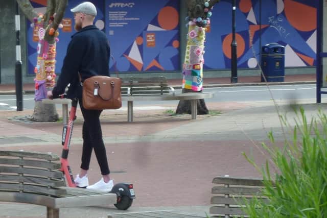 A Voi scooter being rode on the pedestrianised area of Palmoerston Road, Southsea, in May 2022