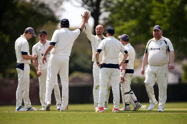 Hayling celebrate a wicket against Portsmouth Community. Picture: Chris Moorhouse