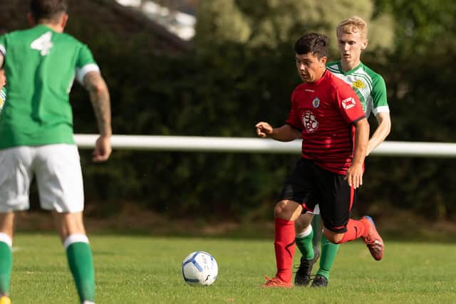 Locks Heath's Connor Johnson runs at the Moneyfields defence. Picture: Keith Woodland