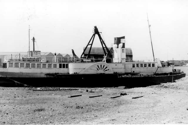 The former paddle steamer Solent lying alongside the A27 at Paulsgrove in the 1950s shortly after her arrival as a cafe. In the background are the buildings of the former Vosper Thornycroft shipyard.