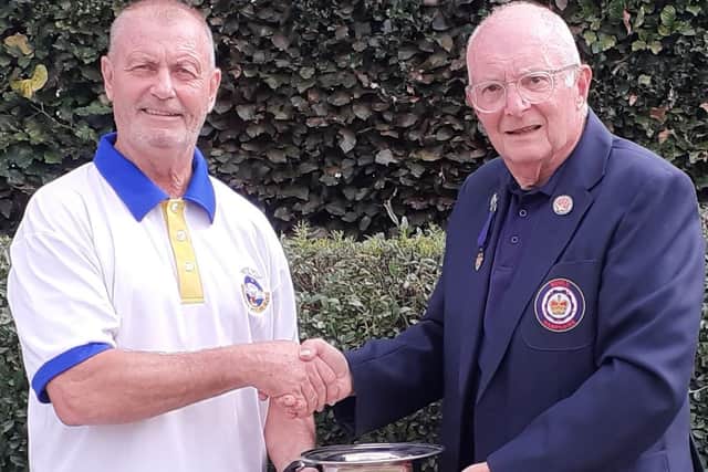 Men's Over 60's Singles winner Phil Pinder, with the P&D President