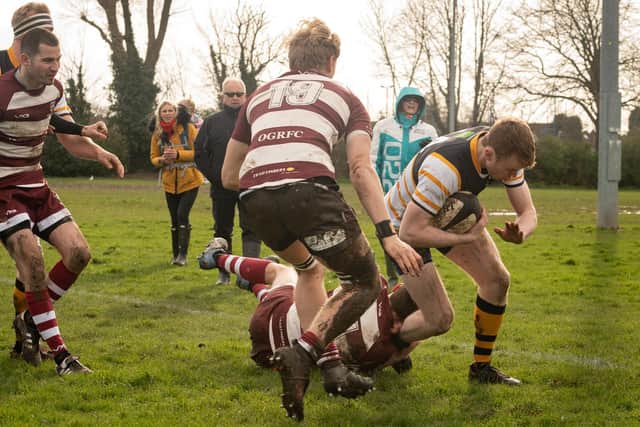 Thomas Hopkins forces his way over. Picture: Keith Woodland (29022020-427)