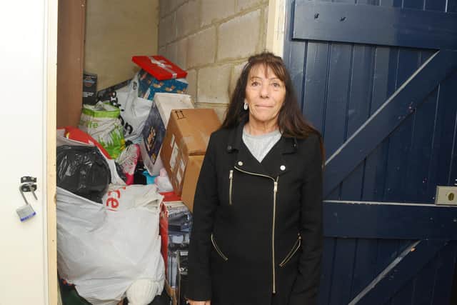 Residents at Guinness flats in West Leigh are angry as the housing association is taking away their storage sheds to provide a sprinkler system and not providing an alternative storage facilty.Pictured is: Denise Jenkins (58) from Solent House, next to her shed which is full of her belongings and has nowhere else to store them.Picture: Sarah Standing (301020-7295)