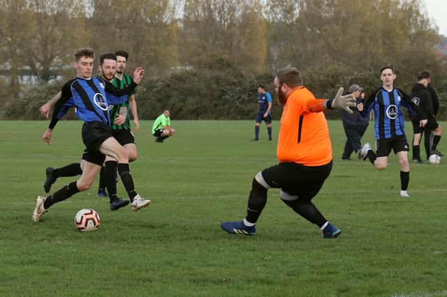 Padnell (blue/black) v AFC Fairfields Reserves. Picture by Kevin Shipp
