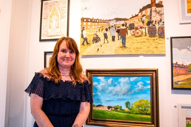 Winner Theresa Forrest with her painting Family Time (top)