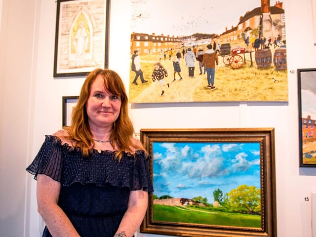 Winner Theresa Forrest with her painting Family Time (top)