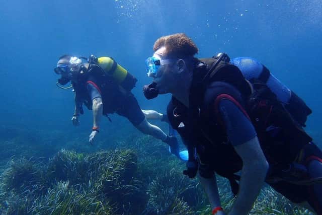 Paul Alland and Paul Griffin scuba diving in Menorca in 2017.