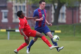 Tom Cain, right, in action for US Portsmouth during last weekend's FA Vase semi-final win against Flackwell Heath. Picture: Stuart Martin