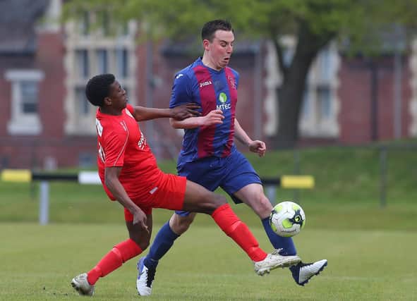 Tom Cain, right, in action for US Portsmouth during last weekend's FA Vase semi-final win against Flackwell Heath. Picture: Stuart Martin