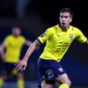 Midfielder Alex Gorrin has penned a short-term deal with Oxford United