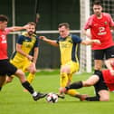 Moneyfields' Callum Glen (yellow) scored last night's stoppage time winner against former club Baffins. Picture: Keith Woodland