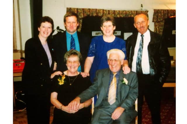 Norma and Bruce with family on their 50th wedding anniversary.
