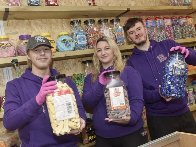Owner's Grace Inns, Isaac White and volunteer Archie show some of the sweets on offer at Jolly Jellies.  Picture: Sarah Standing (101224-7564)