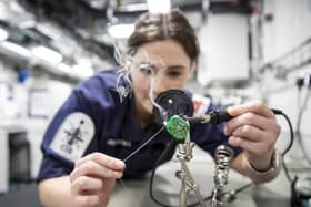 Images of Engineering Technician Communications Information Systems (Weapons Engineer) Laura Suttle as she works to repair a telephone handset on board HMS Queen Elizabeth. Picture: Royal Navy