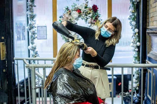 Hardy salon, Southsea, are open for their busiest ever month.
Pictured: Yasmin Leigh with a customer at her salon on 4 December 2020.
Picture: Habibur Rahman