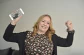 Clare Atfield (39) from Havant, has been reunited with her mobile phone after losing it in the solent in Eastney whilst paddleboarding 460 days ago.Picture: Sarah Standing (181122-6775) 