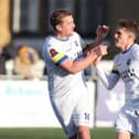 Jamie Collins, left, congratulates goalscorer Alfy Whittingham after he brought Hawks level at Slough Picture: Dave Haines