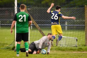 Action from Saturn Royale's 1-0 win over Pelham Arms (blue and yellow kit) in the second Adelaide Cup semi-final. Picture: Keith Woodland (300421-1151)