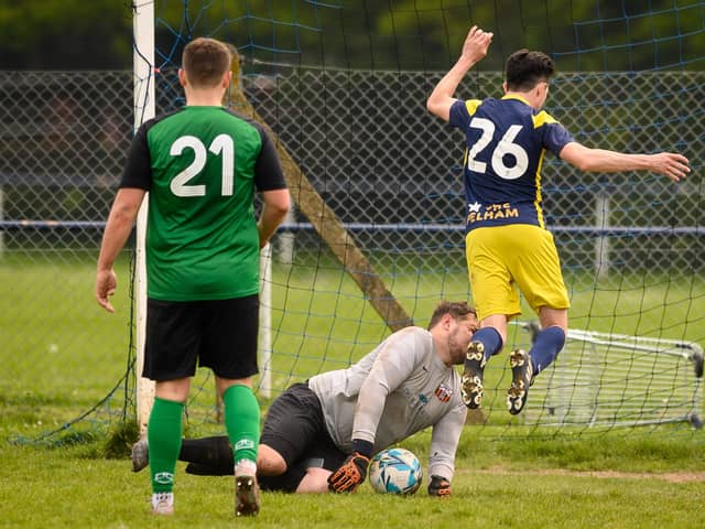 Action from Saturn Royale's 1-0 win over Pelham Arms (blue and yellow kit) in the second Adelaide Cup semi-final. Picture: Keith Woodland (300421-1151)