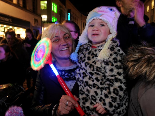 Commercial Road in Portsmouth turned on their Christmas lights on in 2015 with a fireworks display finale.    Pictured is: May Sneddon (58) with her granddaughter Emily-May McClure (1) both from Milton.  Picture: Sarah Standing (151929-2084)