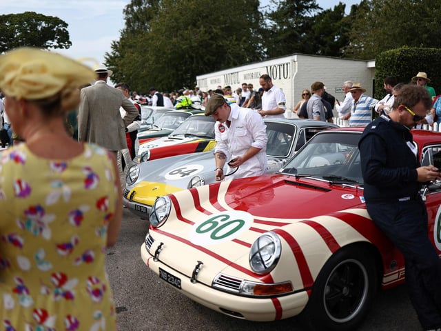 Mechanics prepare classic cars ahead of a race during the opening day of Goodwood Revival at the Goodwood Motor Circuit in Chichester on September 8, 2023. The only historic motor race meeting to be staged entirely in a period theme, Goodwood Revival is an immersive celebration of iconic cars and fashion.