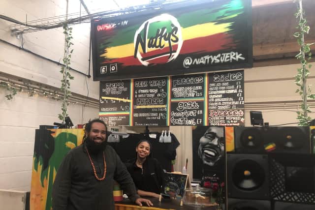 Nat Crutchfield, owner of Natty's Jerk, with his daughter CC, at Outside-In Food Court in Portsmouth. 
