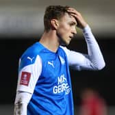 Peterborough's Jack Taylor looks dejected after his side's FA Cup defeat at the hands of Chorley.  Picture: Catherine Ivill/Getty Images