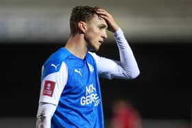 Peterborough's Jack Taylor looks dejected after his side's FA Cup defeat at the hands of Chorley.  Picture: Catherine Ivill/Getty Images