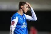 Peterborough's Jack Taylor looks dejected after his side's FA Cup defeat at the hands of Chorley.  Picture: Catherine Ivill/Getty Images