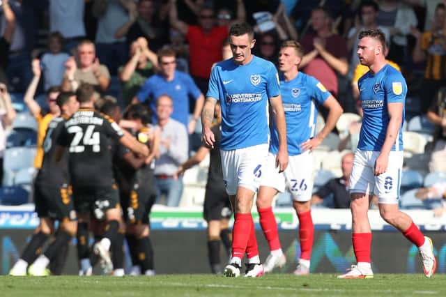 The Pompey players look downbeat after Joe Ironside opened the scoring for Cambridge United in the 38th minute at Fratton Park.