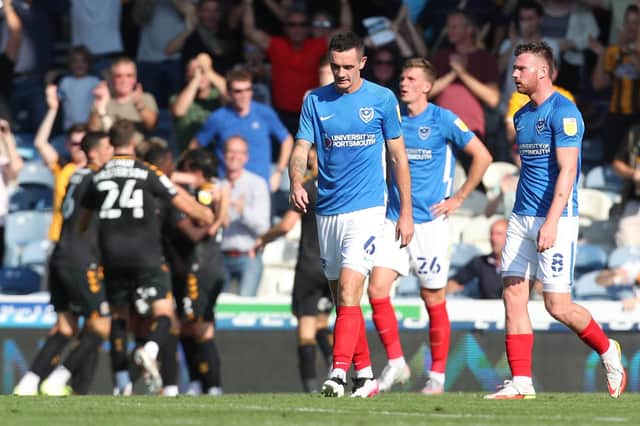 The Pompey players look downbeat after Joe Ironside opened the scoring for Cambridge United in the 38th minute at Fratton Park.