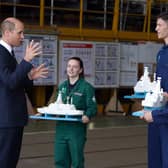 BAE Systems' workers present the Duke of Cambridge with three model of the Type 26 frigate for his children. Photo:  Royal Navy