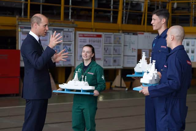 BAE Systems' workers present the Duke of Cambridge with three model of the Type 26 frigate for his children. Photo:  Royal Navy
