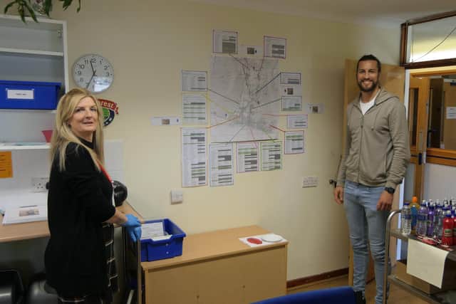 Portsmouth player Christian Burgess visited Hayling Island to help the staff and coaches from Heart of Hayling Boxing Academy deliver prescriptions to people in the community. Pictured: Wendy Ball, who set up the Hayling Helpers, with Christian Burgess