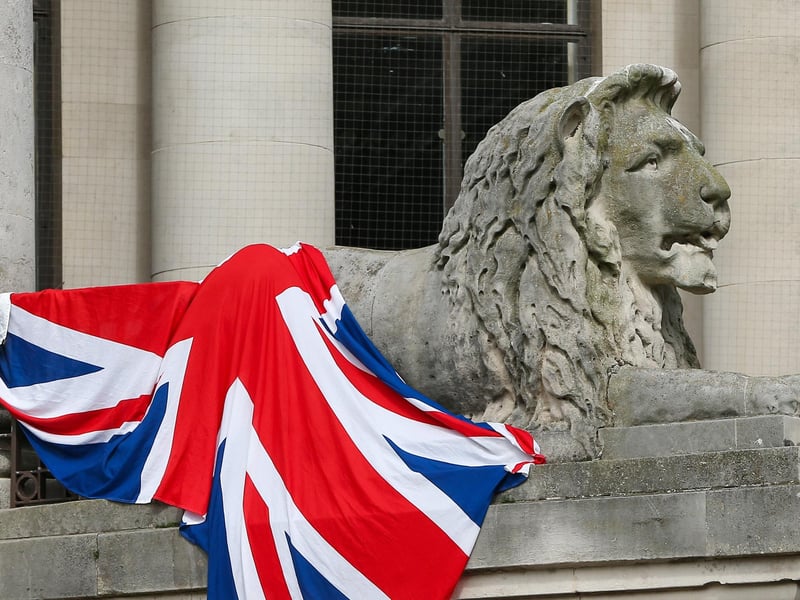 Portsmouth lion draped in Union flag at a protest in Guildhall Square, Portsmouth. Picture: Chris  Moorhouse (030824-30)
