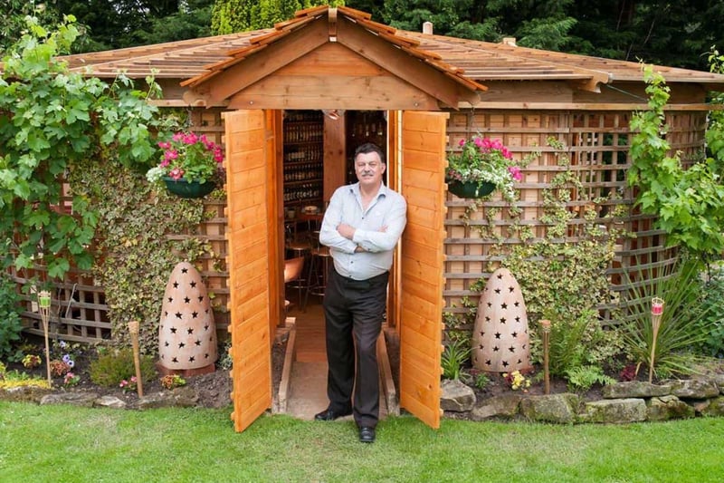 This is Shed of the year 2012 - Woodhenge, built by John Plumridge
The main feature is its unique shape. its a heart, and its in the heart of my garden. I was unsure of what category to list it in as it is quite unique - but its just a pub in my garden that's a shed. There is a beer bottle collection of Real Ales which is around 500 and counting, and around 110 ciders all on display.