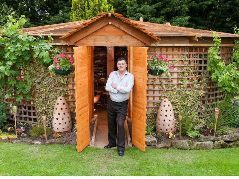 This is Shed of the year 2012 - Woodhenge, built by John Plumridge
The main feature is its unique shape. its a heart, and its in the heart of my garden. I was unsure of what category to list it in as it is quite unique - but its just a pub in my garden that's a shed. There is a beer bottle collection of Real Ales which is around 500 and counting, and around 110 ciders all on display.