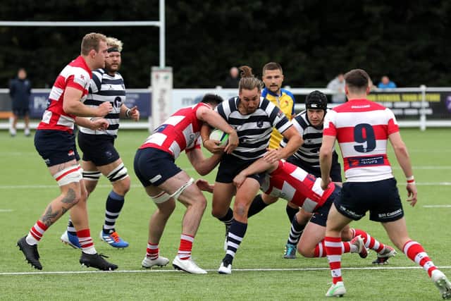 A Havant player is stopped in his tracks against Dorking. Picture: Sam Stephenson