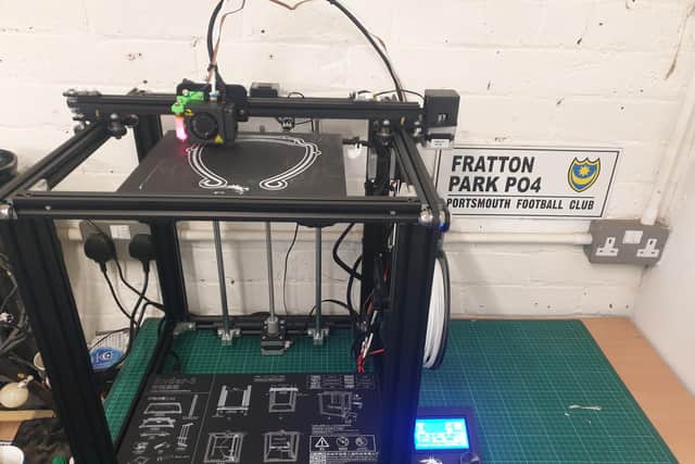 Ben's 3D printer at work creating a mask. Picture: Supplied