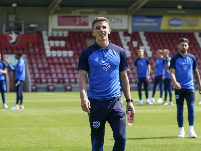 Tom Lowery and his new Pompey team-mates checking out the turf at Whaddon Road.