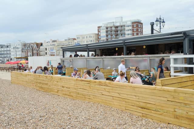 Restaurant goers enjoy dining at Southsea Beach Cafe along Southsea seafront in summer 2019. Picture: Sarah Standing (050719-2852)