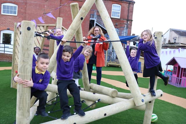 Councillor Suzy Horton with children enjoying their new outdoor play spaces at Penbridge Infant School. Picture by Samuel Poole