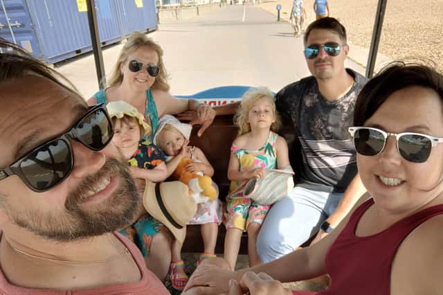 Back row, from left: Cheryl's sister Michelle Nicholls with Harley, her daughters Florence and Sienna and husband Shaun. Front row: Matt and Cheryl.