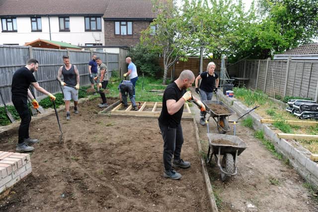 Children’s charity WellChild is making over the garden of 10-year-old Archie from Portsmouth as one of its renowned Helping Hands projects. Together with volunteers from the companies Propp and Firmitas, Fareham, they plan to give Archie a garden that he can access safely and with as much independence as possible. Picture: Sarah Standing (030522-3375)