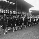 The Girls Life Brigade parading across the Fratton Park turf about 1942. Theresa Proudlock (nee Clancy) is the second girl in a white
blouse in the line furthest from the camera.
Picture: Courtesy of Michael Proudlock