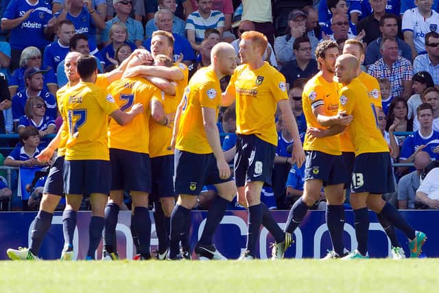 Oxford United celebrate their 4-1 win over Pompey in 2013