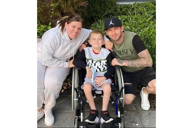 Jake Carson-Blake, 8, with mum Ali and dad Nathan
Picture: Ali Carson-Blake