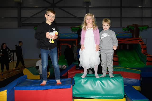 Pictured is: William and Isabel Youngs with Henry Wilson
Picture: Keith Woodland (131121-3)