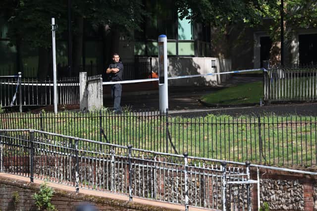 Police near an entrance to Forbury Gardens in Reading town centre Picture: Jonathan Brady/PA Wire